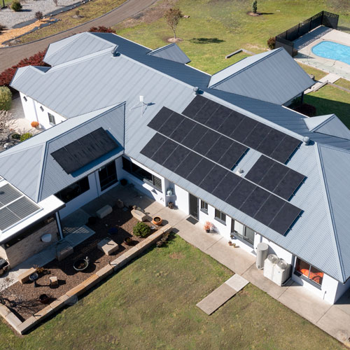 Aerial view of Solahart Silhouette solar panels installed on single storey home in Wallalong NSW